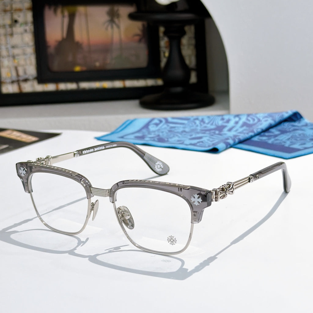 Metal eyeglasses with clear lenses, dark gray frame, and decorative side temples