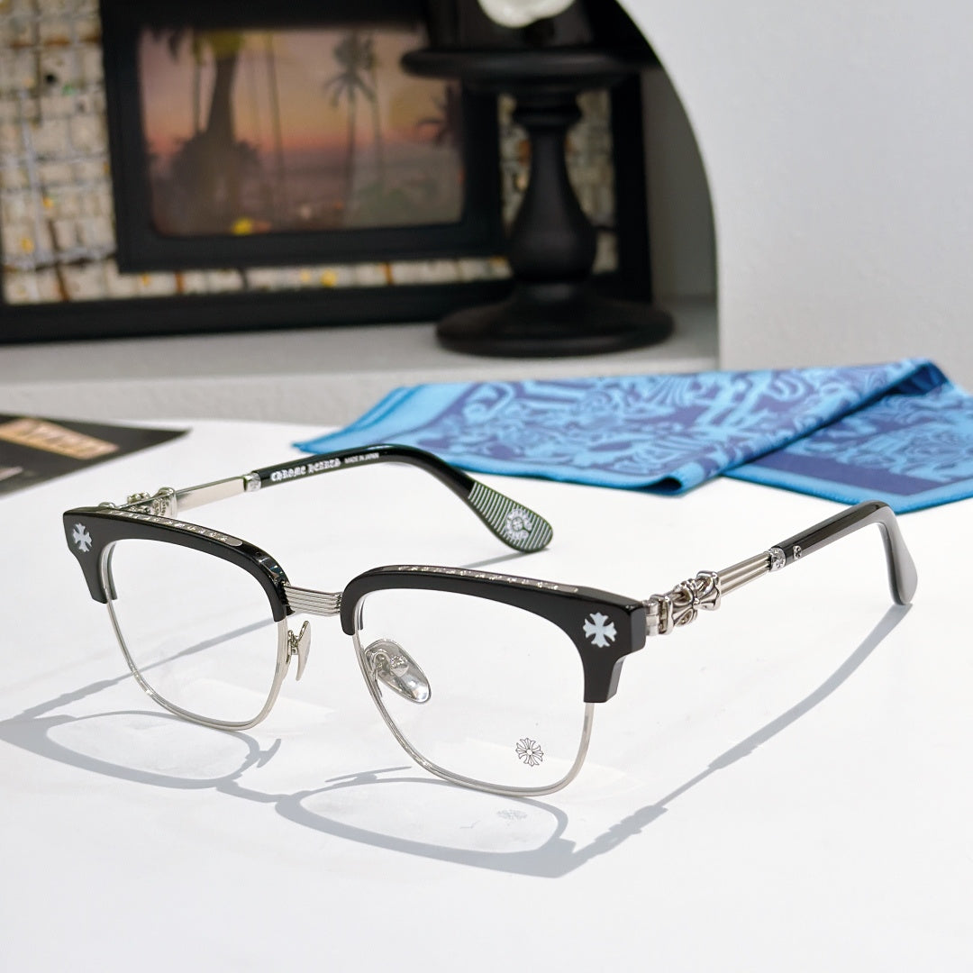 Metal eyeglasses with clear lenses, black frame, and silver-toned side details