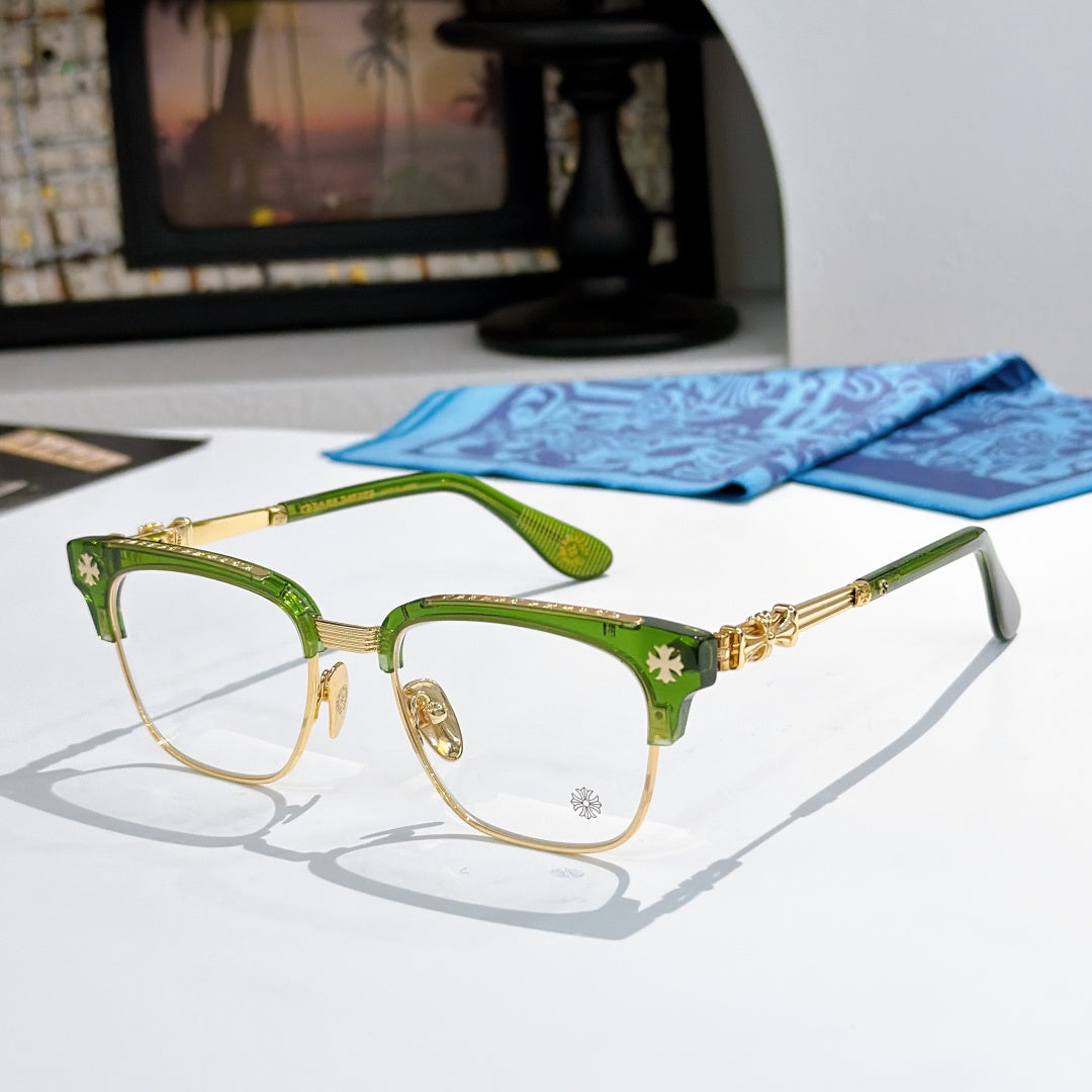 Metal eyeglasses with clear lenses, green frame, and gold-toned decorative temples
