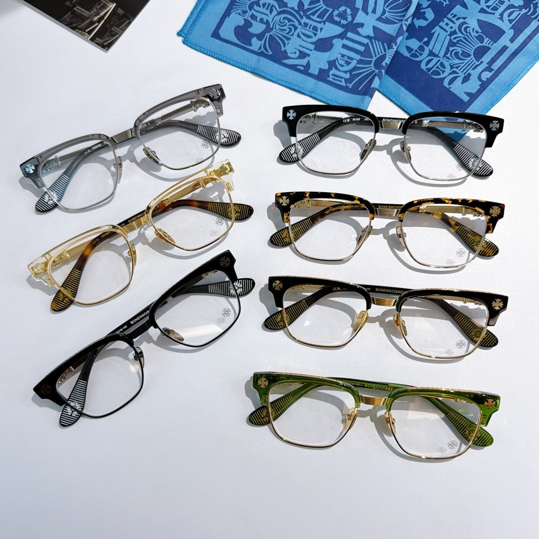 Set of assorted eyeglasses with clear lenses in black, gold, green, and gray frames