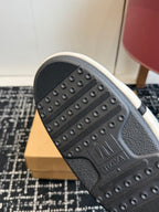 Rubber boot outsole with stud pattern and textured tread grip