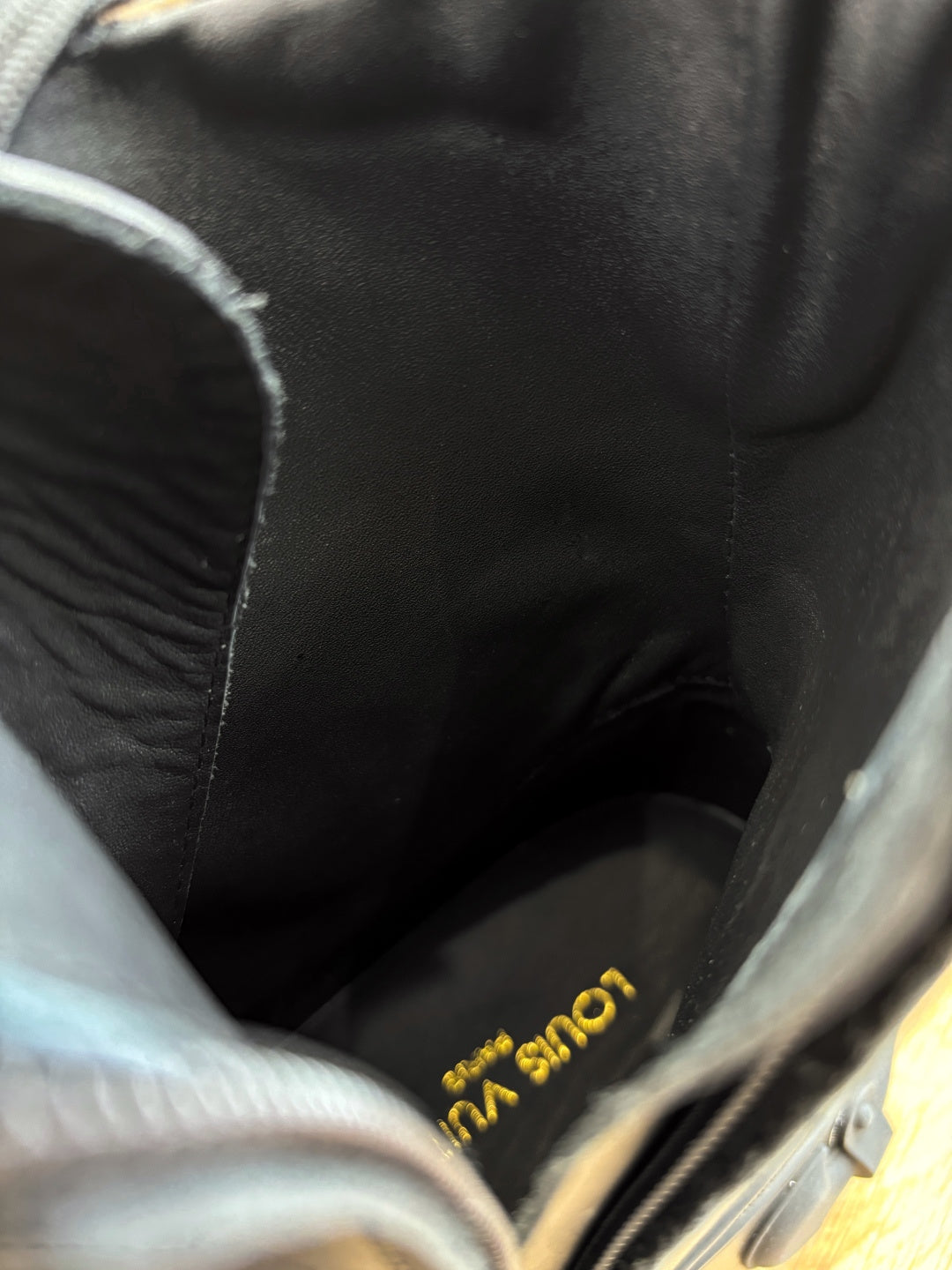 Louis Vuitton unisex boot lining, dark leather with gold logo text