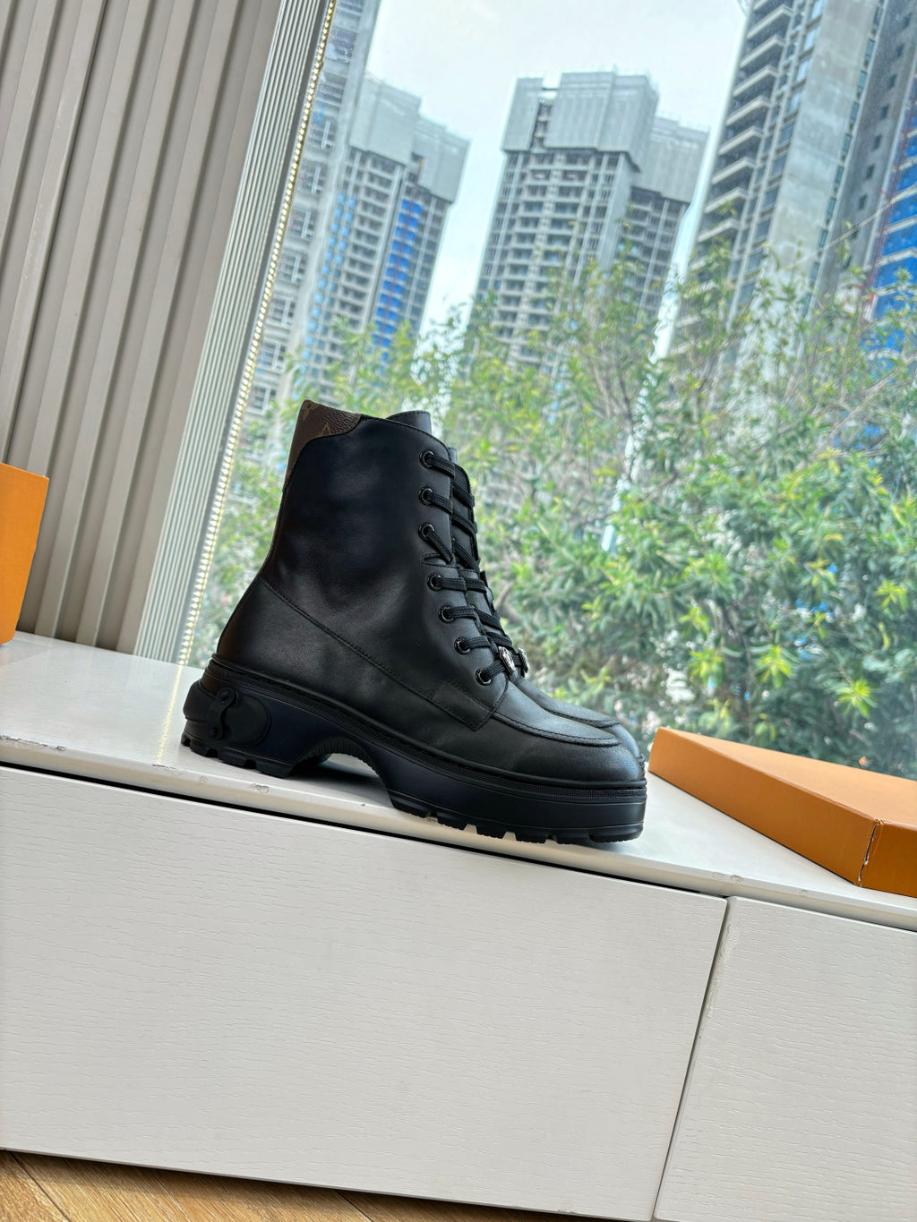 Louis Vuitton unisex lace-up boots, black leather, angled side profile