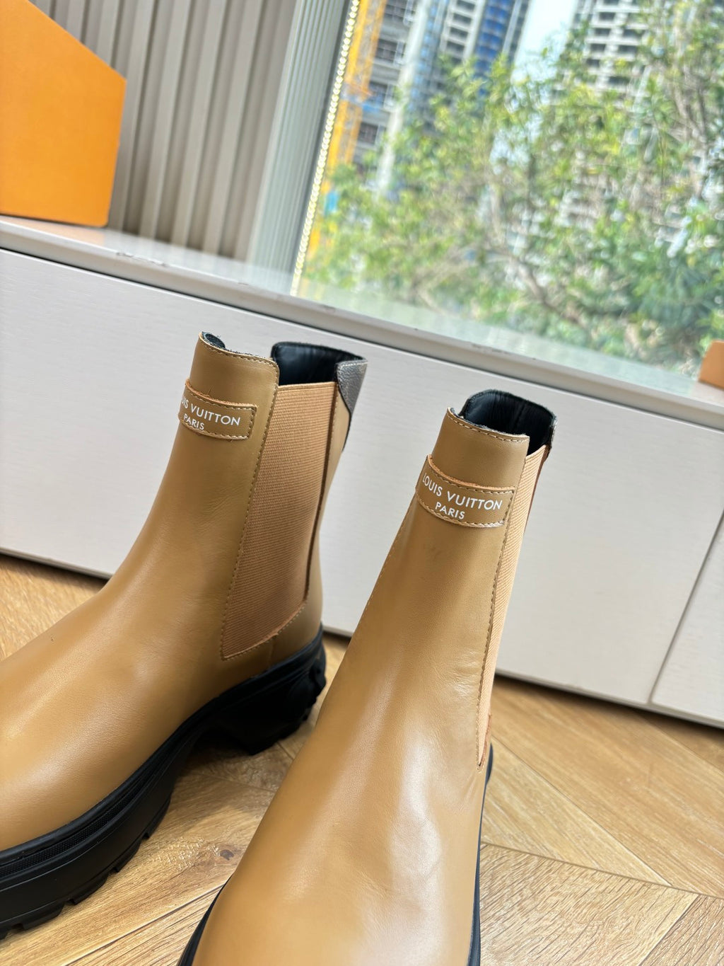 Louis Vuitton tan leather Chelsea boots with elastic sides and logo tab.