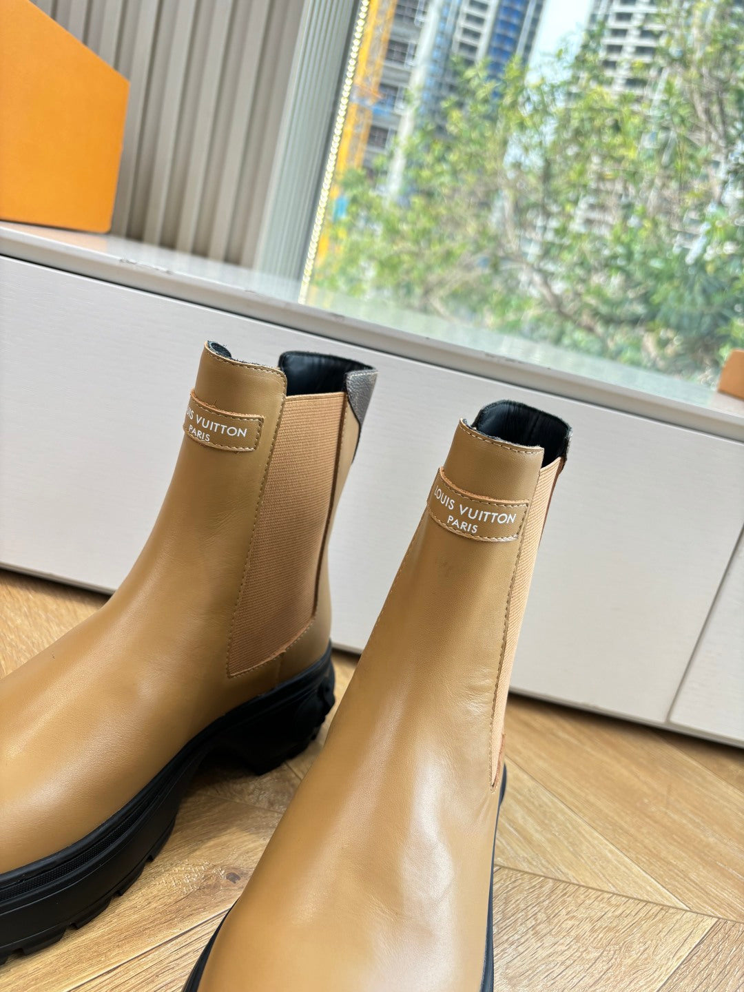 Louis Vuitton tan leather Chelsea boots with elastic sides and logo tab.