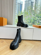 Louis Vuitton unisex black leather chelsea boot with elastic side and lug sole