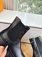 Louis Vuitton unisex black leather chelsea boot with elastic side panel and pull tab