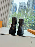 Louis Vuitton unisex lace-up boots with monogram print, dark base, chunky sole