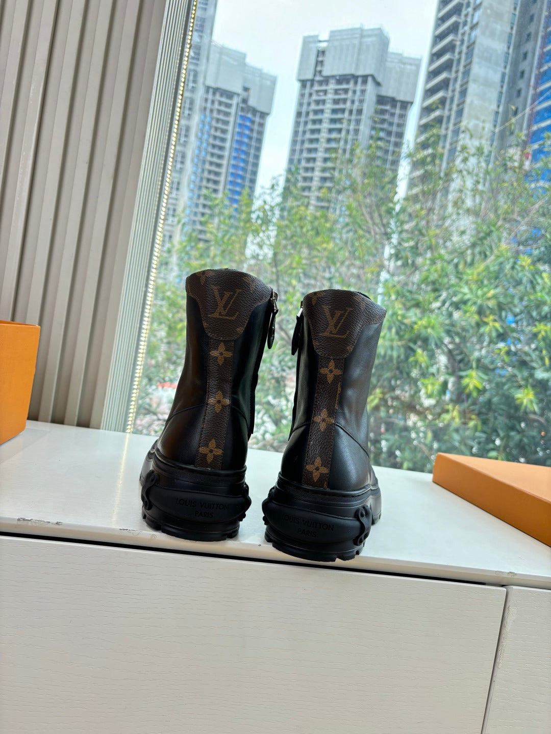 Louis Vuitton unisex lace-up boots with monogram print, dark base, chunky sole