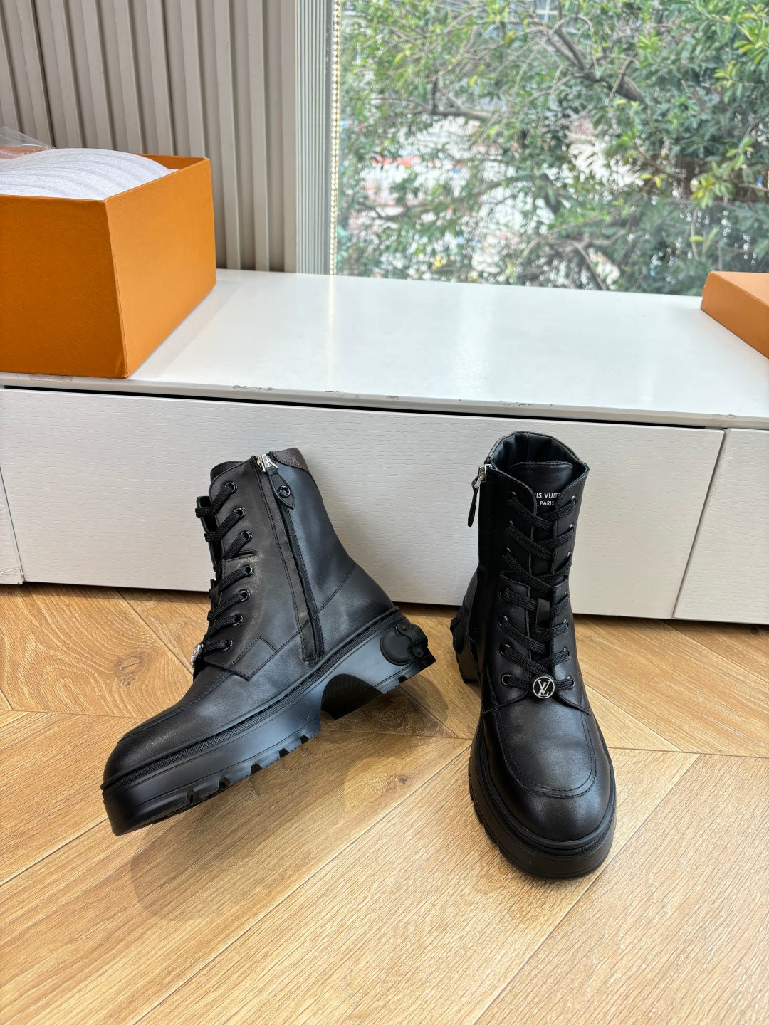 Louis Vuitton unisex lace-up boots, black leather pair with side logo details