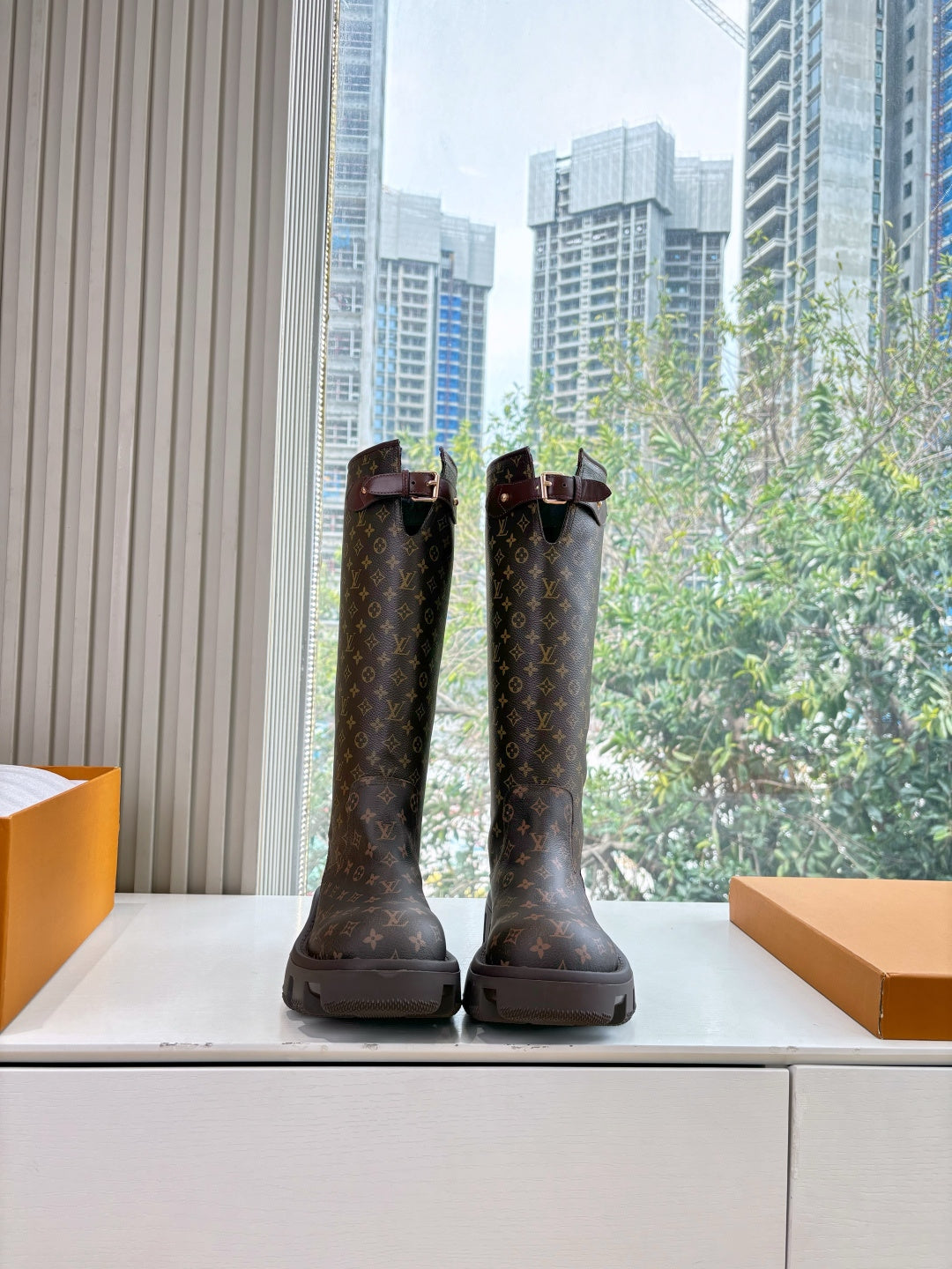Louis Vuitton unisex monogram tall boots with buckle straps and lug sole, dark brown