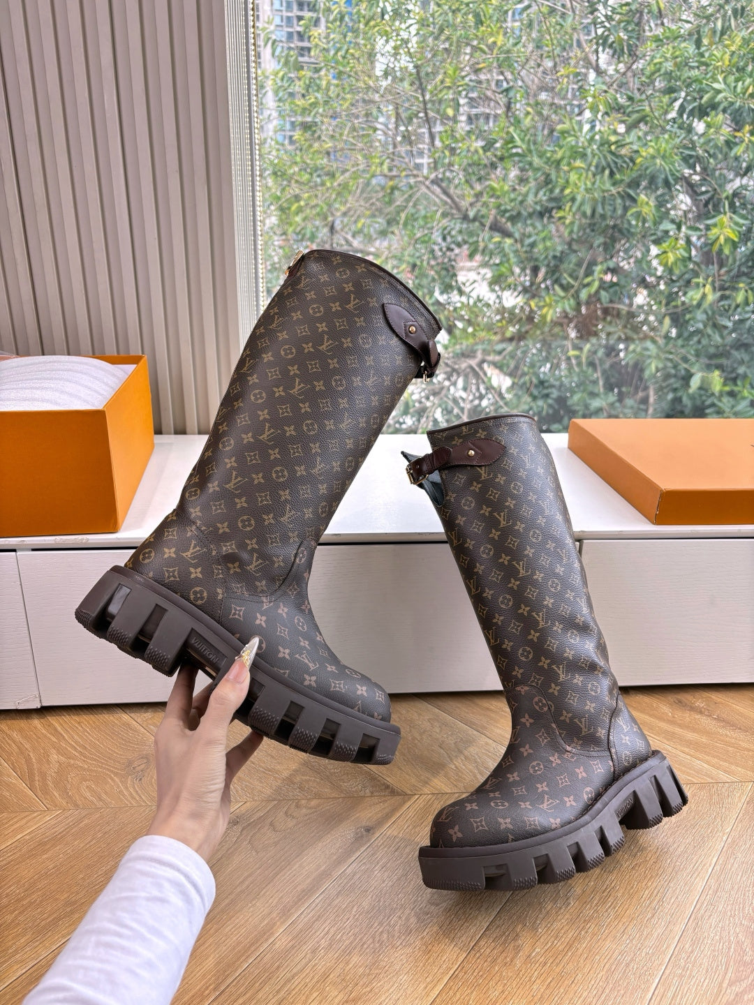 Louis Vuitton unisex monogram tall boots with buckle straps and lug soles, dark brown