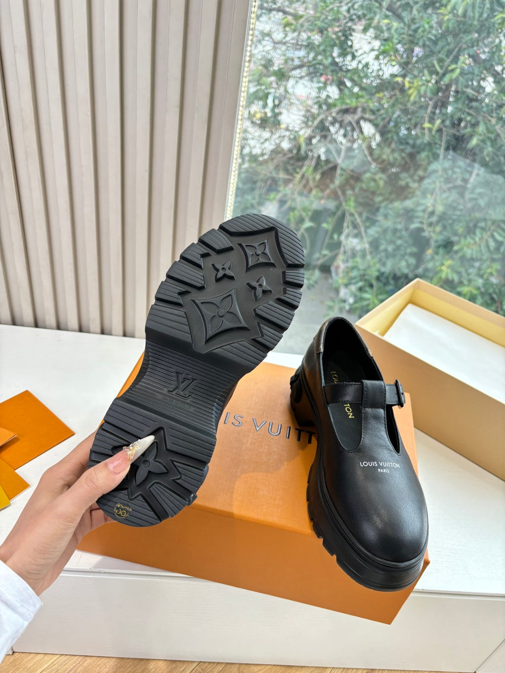 Louis Vuitton loafers with textured rubber outsole, black leather upper