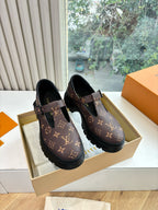 Monogram slip-on shoes with black rubber sole, dark brown canvas and buckle straps