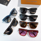 Group of Louis Vuitton sunglasses with various blue, black, and brown tinted lenses
