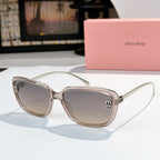 MiuMiu clear champagne sunglasses with rounded square frames and gold logo temples