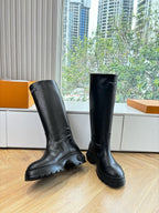 Black knee-high leather boots, two-shoe angled view