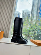 Black knee-high leather boots, three-quarter view