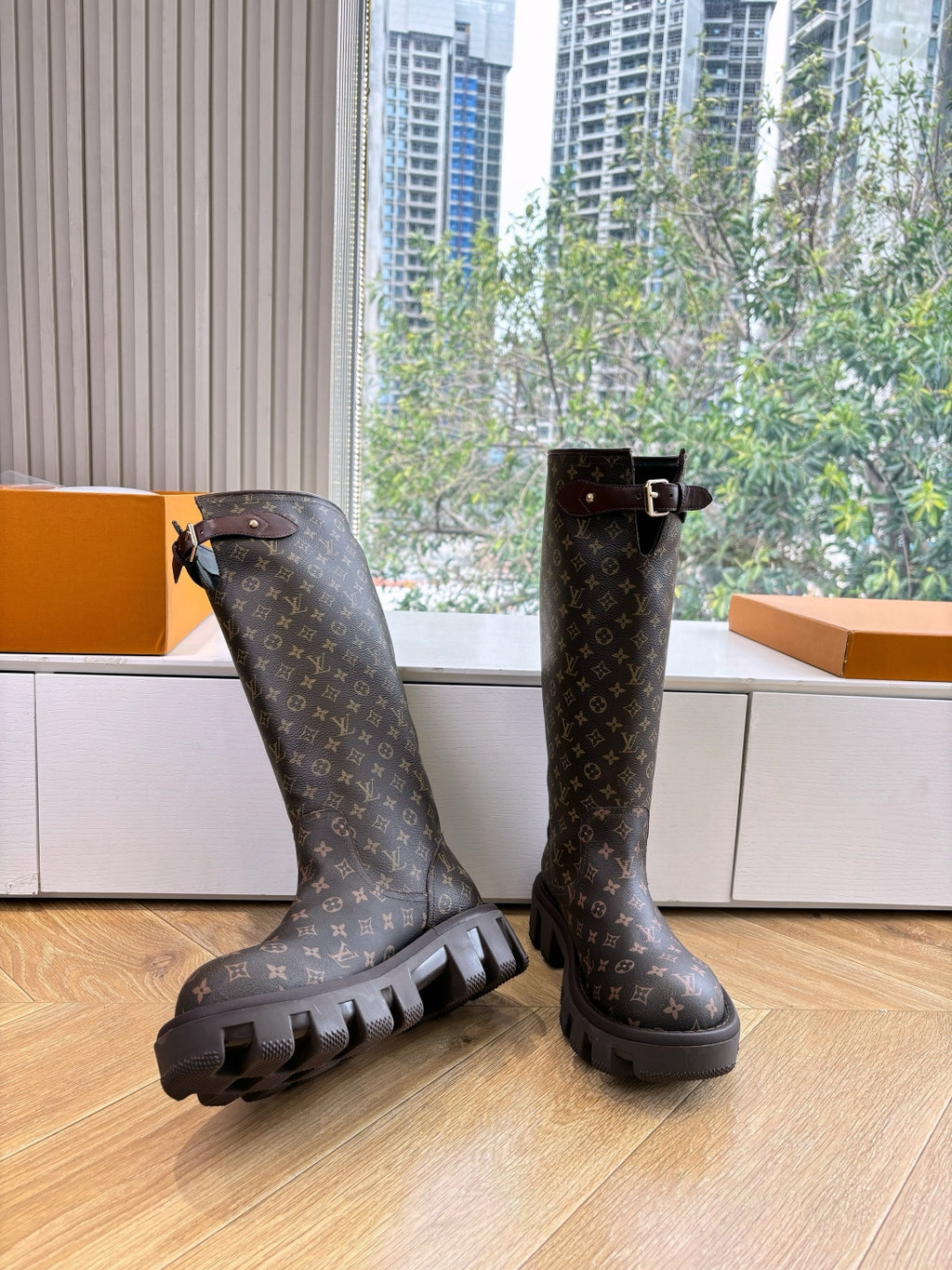 Louis Vuitton unisex monogram tall boots with buckle straps and rugged lug soles, dark