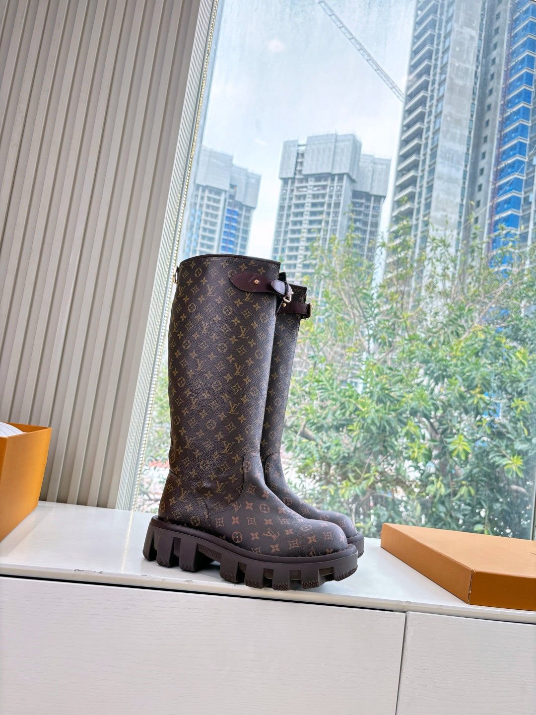 Louis Vuitton unisex monogram tall boots with buckle strap and lug sole, dark brown