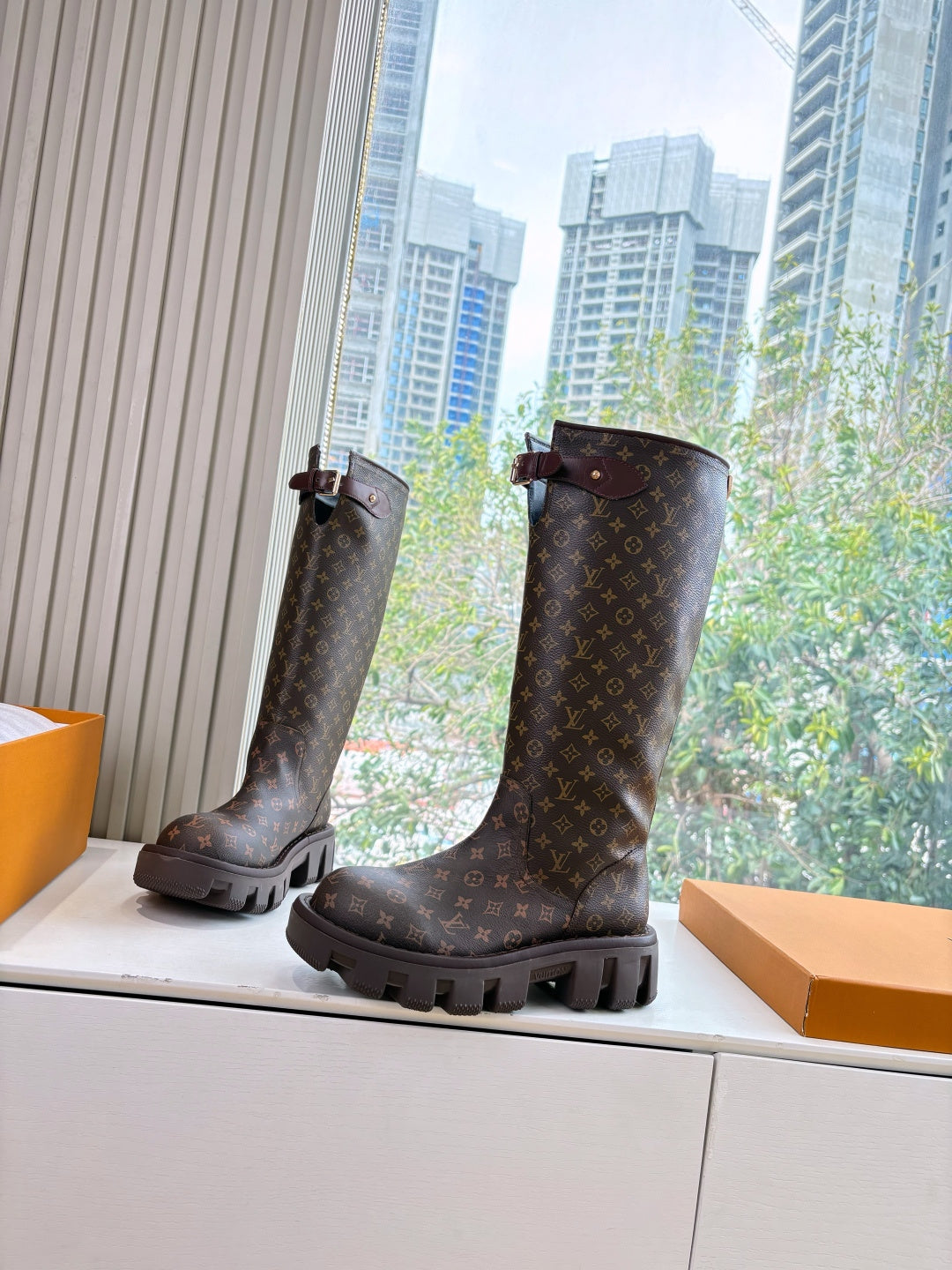 Louis Vuitton unisex monogram tall boots with side buckle strap and chunky lug sole, dark