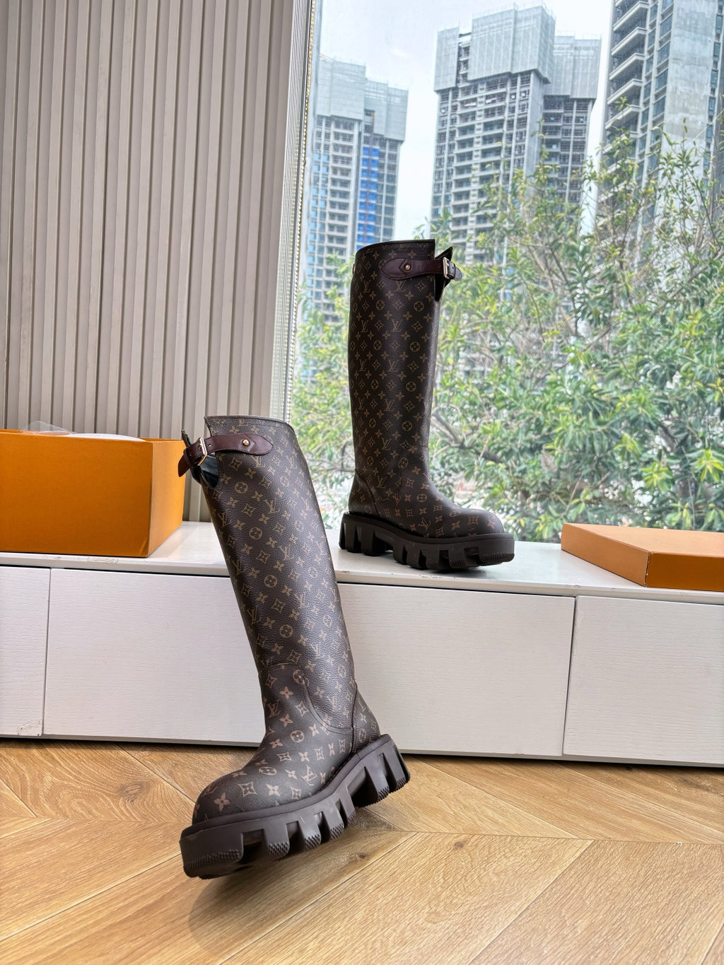 Louis Vuitton unisex monogram tall boots with buckle straps and thick lug soles, dark