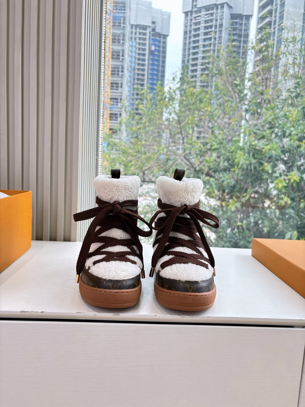 Louis Vuitton unisex high-top sneakers with dark laces and tan rubber sole