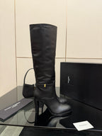 YSL ladies knee-high black leather boots, side view with gold accent buckle