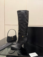 YSL ladies knee-high black leather boots, side view with gold buckle