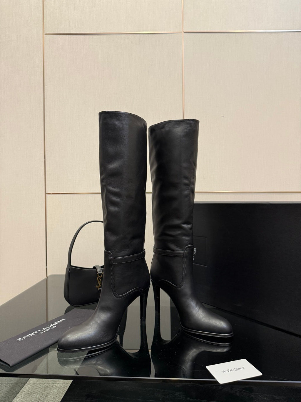 YSL ladies knee-high black leather boots with slim heel, front view