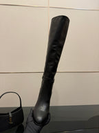 YSL ladies knee-high black leather boots, angled side view