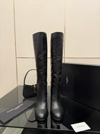 YSL ladies knee-high black leather boots with gold buckle strap