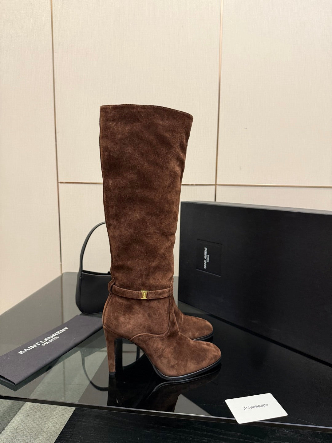 YSL women’s suede knee-high boot, brown, gold buckle strap and high stiletto heel