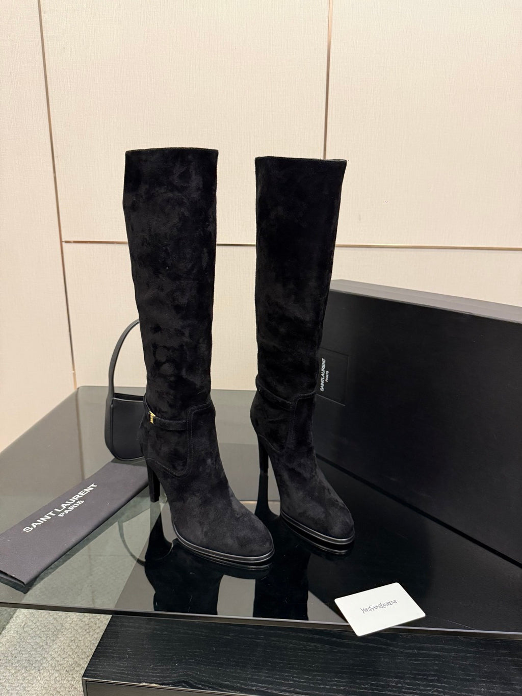 YSL ladies black tall heeled boots, two boots side view with slim heel