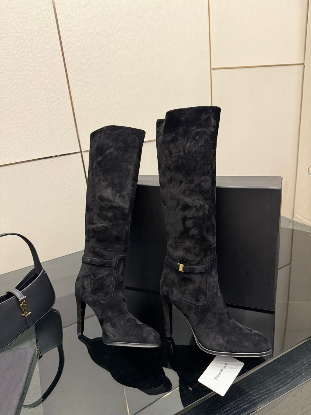 YSL ladies black tall heeled boots, pair angled view with heel and shaft detail