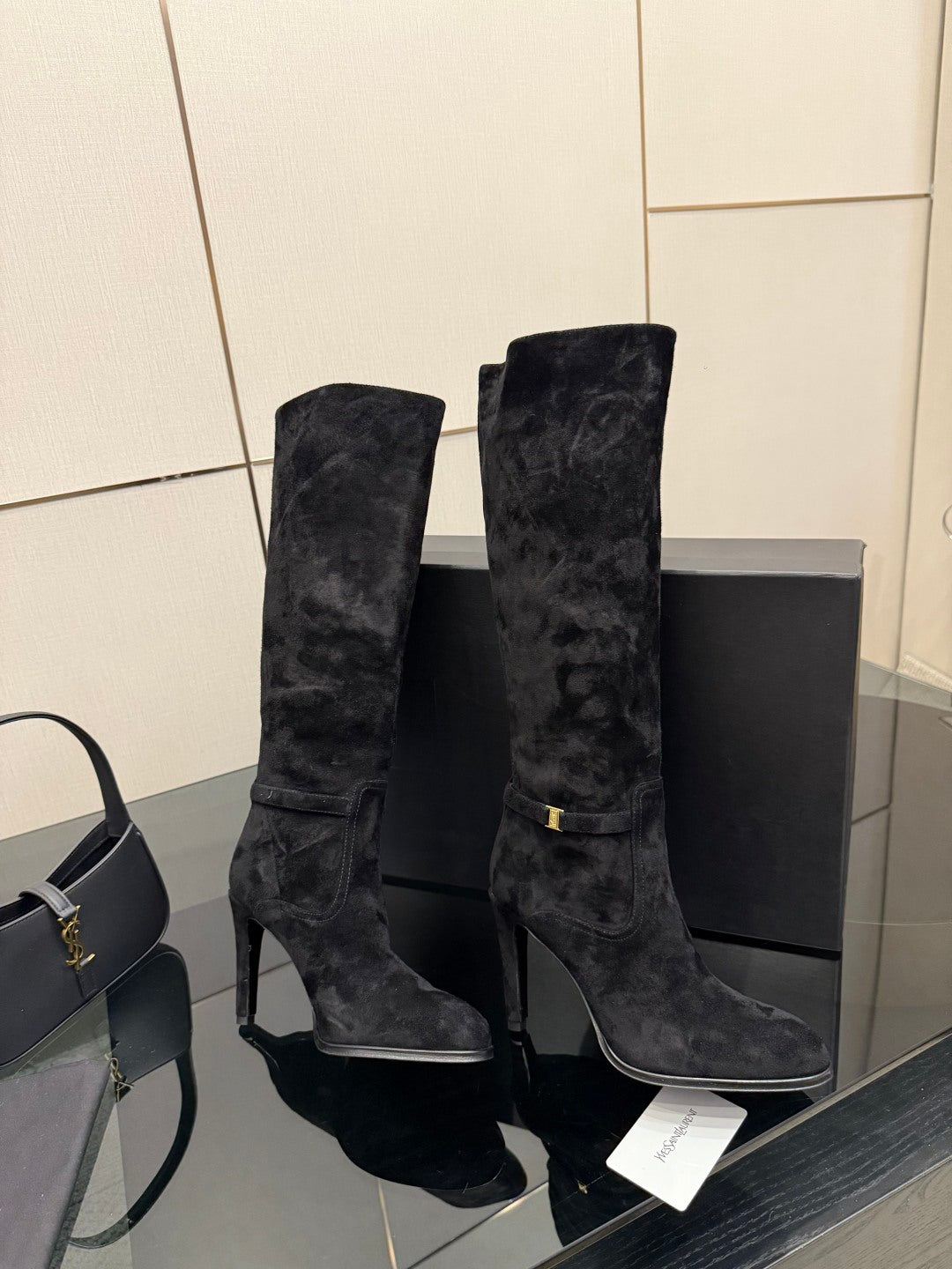 YSL ladies black tall heeled boots, pair angled view with heel and shaft detail