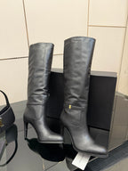 YSL ladies knee-high black leather boots, pair view with gold buckle