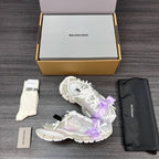 Balenciaga sandals with white upper, lilac ribbon bow, and chunky rubber outsole