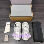 Balenciaga sandals pair in white with lilac ribbon bows and lace-up straps