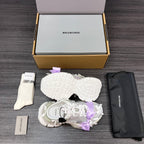 Balenciaga sandals with white sole and lilac ribbon bow, underside view