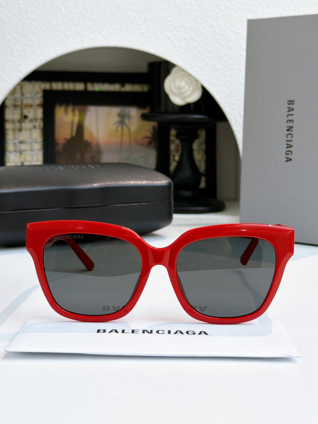 Red cat-eye sunglasses with gray lenses