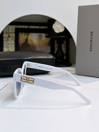 White sunglasses side view with gold logo bar on arm