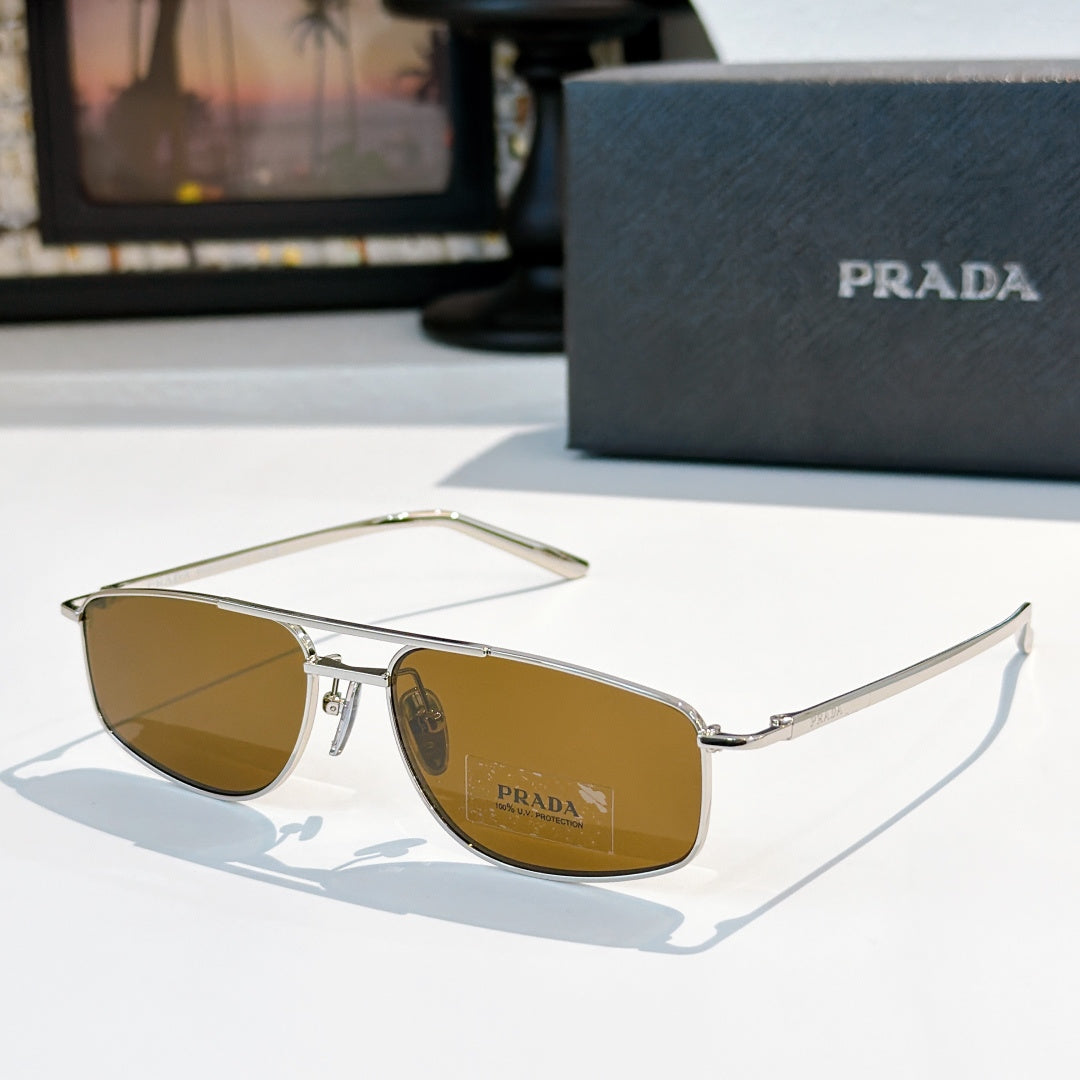 Prada sunglasses with amber lenses and gold-tone frame