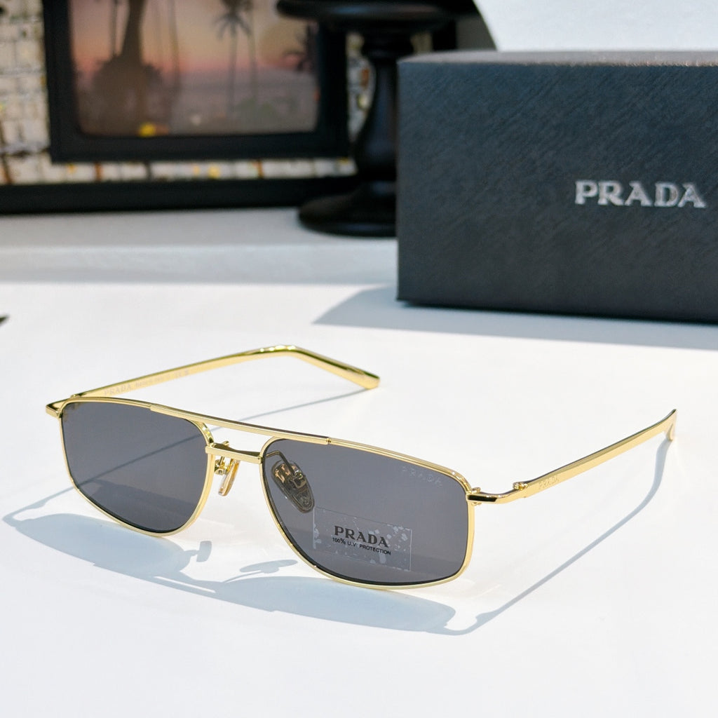 Prada sunglasses with dark lenses and gold-tone frame