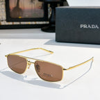 Prada sunglasses with brown lenses and gold-tone frame
