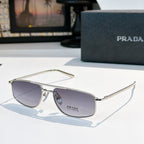 Prada sunglasses with dark lenses and silver frame