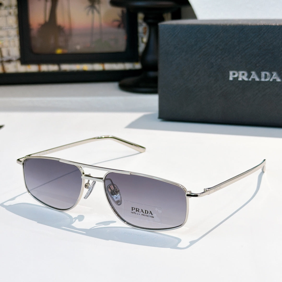 Prada sunglasses with dark lenses and silver frame