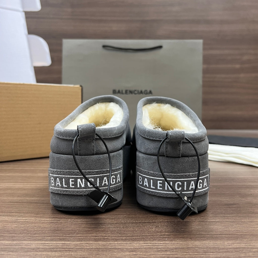 Balenciaga gray suede mules with cream fleece lining and black lace hardware