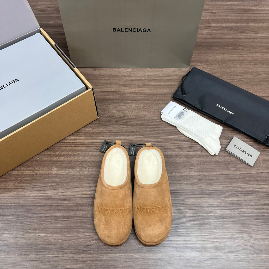 Tan suede sandals with beige lining and black drawstring tags