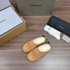 Tan suede sandals with black lace-like drawstrings and padded lining